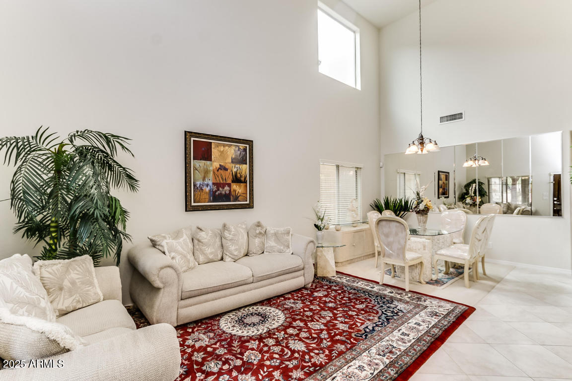 1827 West Black Hill Road Phoenix, AZ 85085 - Photo 3 of 49 a living room with furniture and a rug