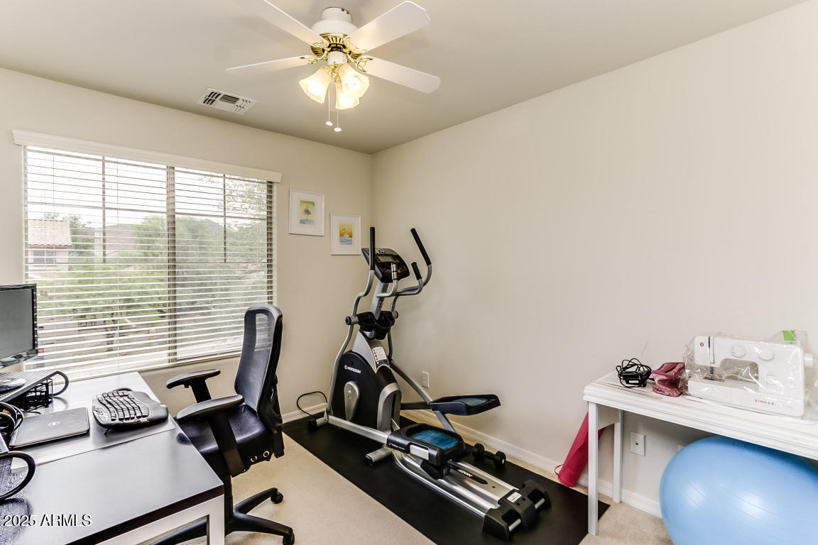 1827 West Black Hill Road Phoenix, AZ 85085 - Photo 31 of 49 a view of a workspace with furniture and a window