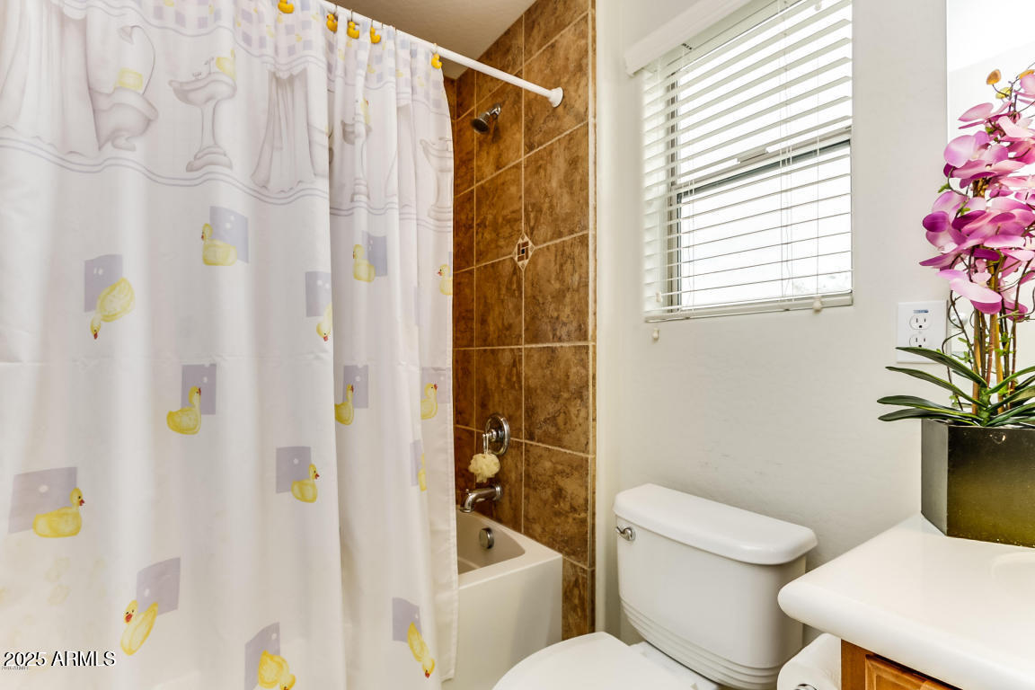 1827 West Black Hill Road Phoenix, AZ 85085 - Photo 36 of 49 a bathroom with a toilet and shower