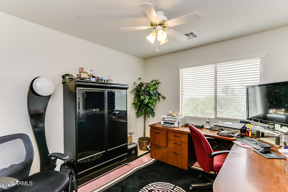 1827 West Black Hill Road Phoenix, AZ 85085 - Photo 37 of 49 a view of a livingroom with furniture and a window