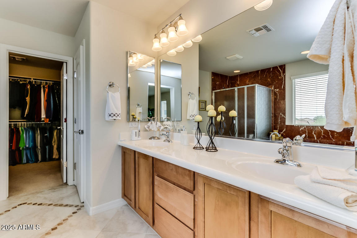 1827 West Black Hill Road Phoenix, AZ 85085 - Photo 38 of 49 a bathroom with a sink double vanity and a mirror