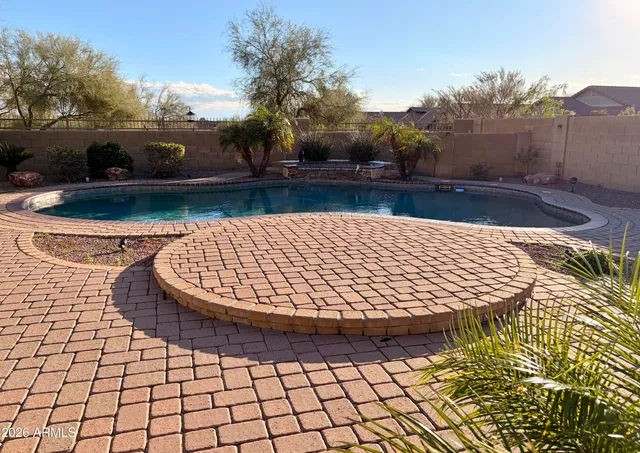 a bathroom with a tub and a shower