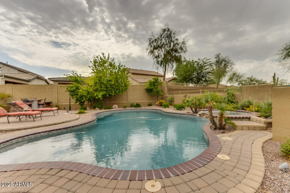 1827 West Black Hill Road Phoenix, AZ 85085 - Photo 42 of 49 a view of a swimming pool with a lounge chairs