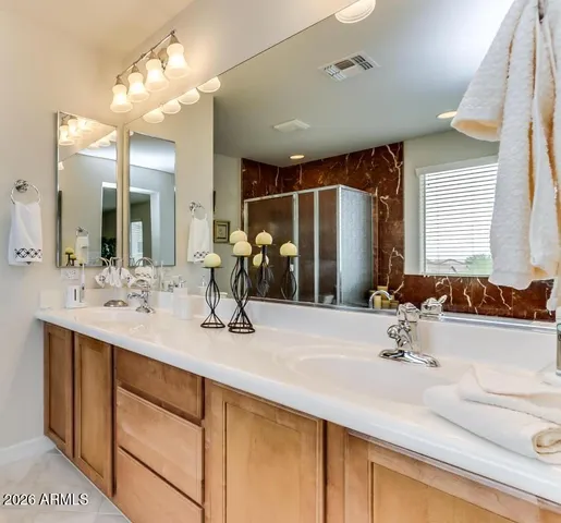 a view of a patio with dining table and chairs