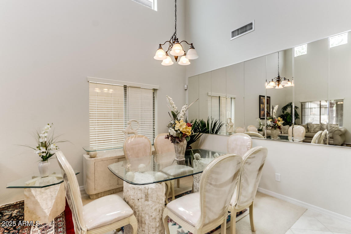 1827 West Black Hill Road Phoenix, AZ 85085 - Photo 7 of 49 a dining room with furniture and chandelier