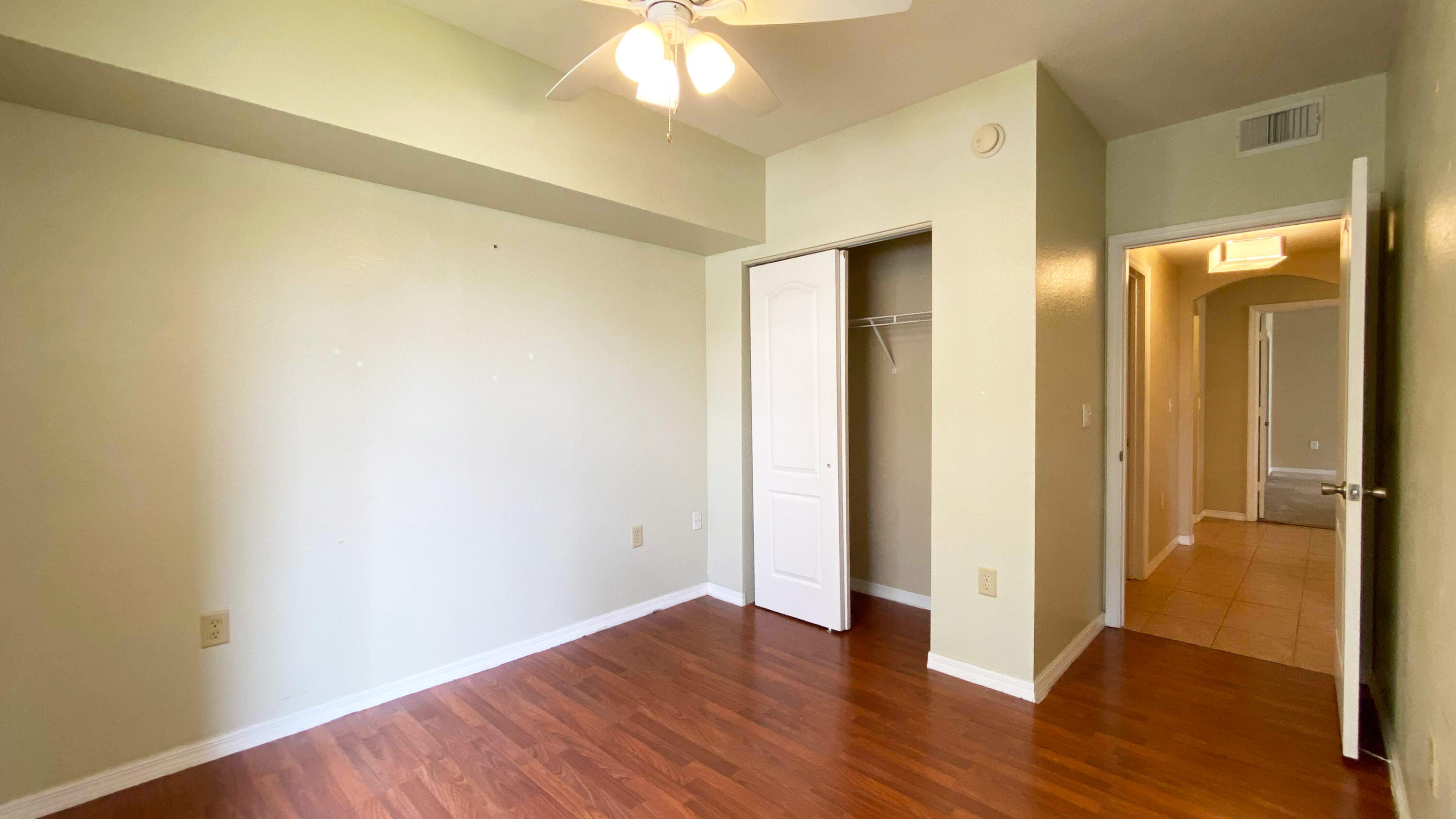 118 Southwest Peacock Boulevard, Unit 101 Port St. Lucie, FL 34986 - Photo 15 of 38 a view of a hallway with wooden floor