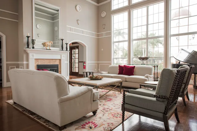 a living room with furniture and a fireplace