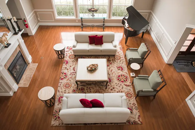 a living room with furniture and a rug