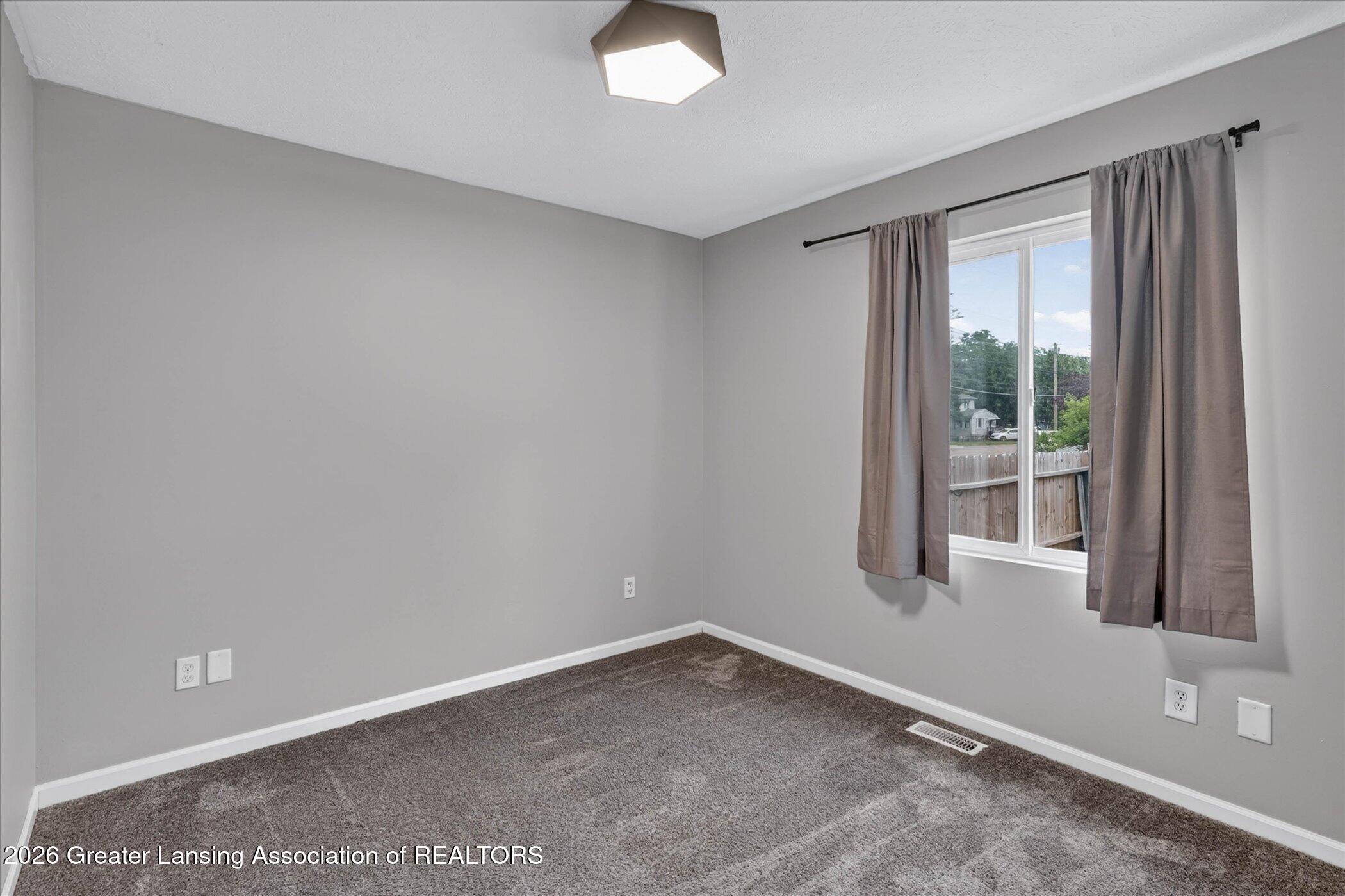 5105 Hughes Road Lansing, MI 48911 - Photo 12 of 26 21-5105-Hughes-Rd-WindowStill-Photograph