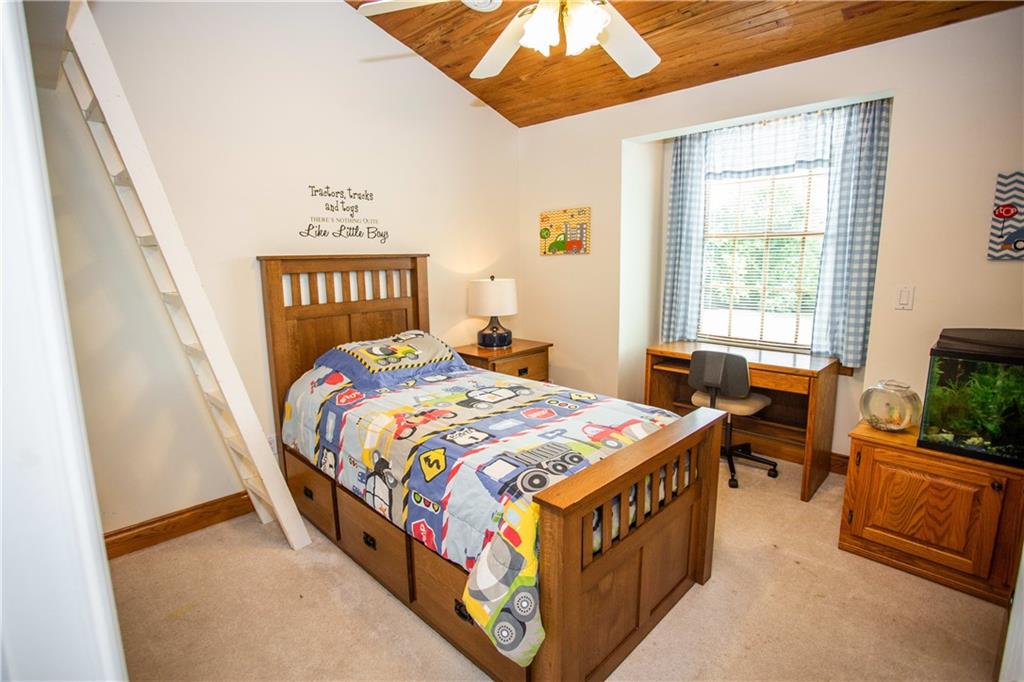 2844 Laurel Run Road Clymer, PA 15728 - Photo 23 of 25 a bedroom with a bed a flat screen tv and a window