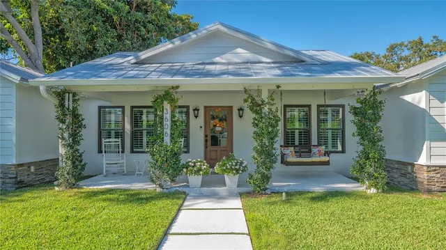 a wooden bench sitting in front of a window