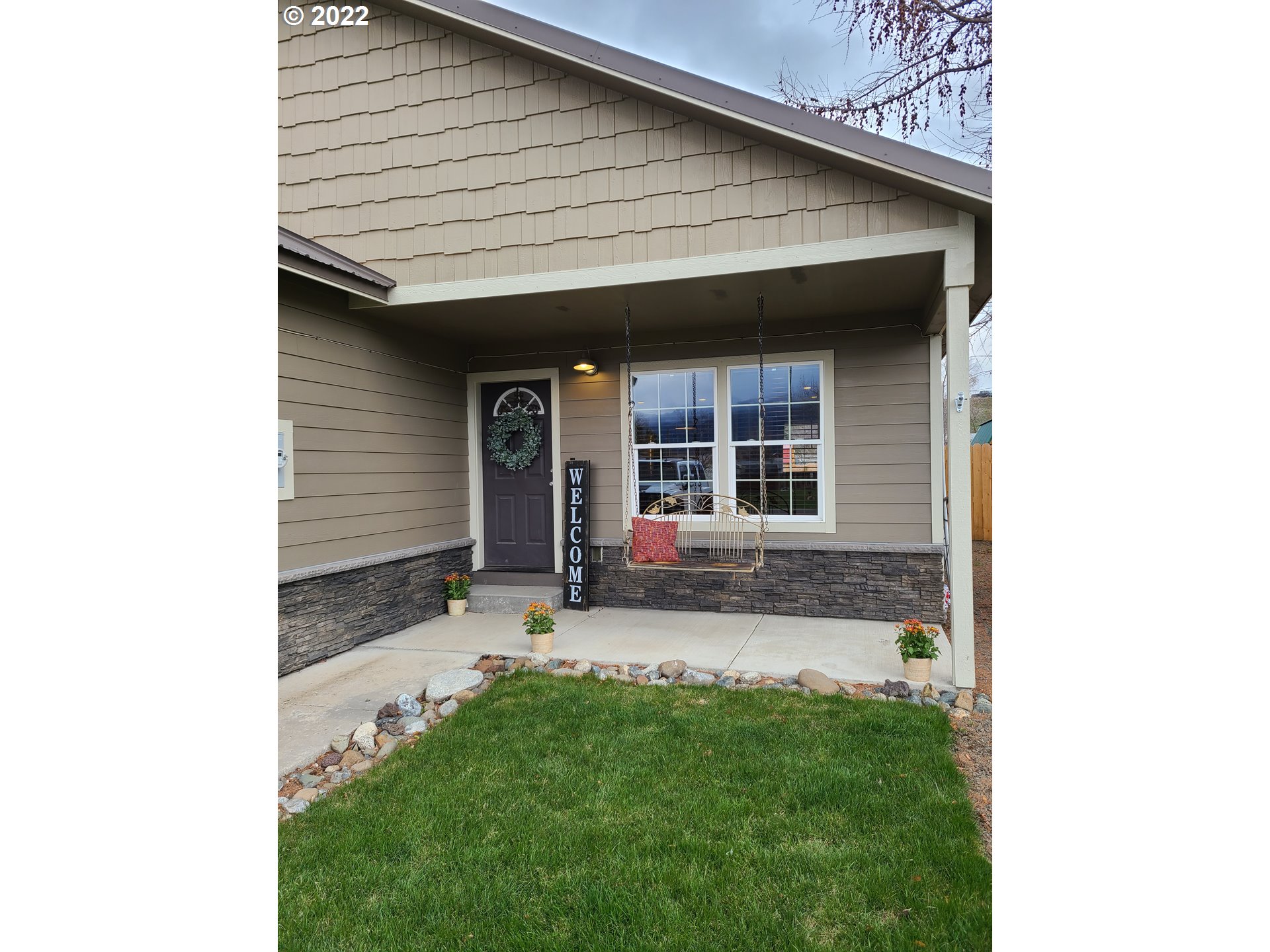 104 North College Street Joseph, OR 97846 - Photo 3 of 17 a front view of a house with a yard