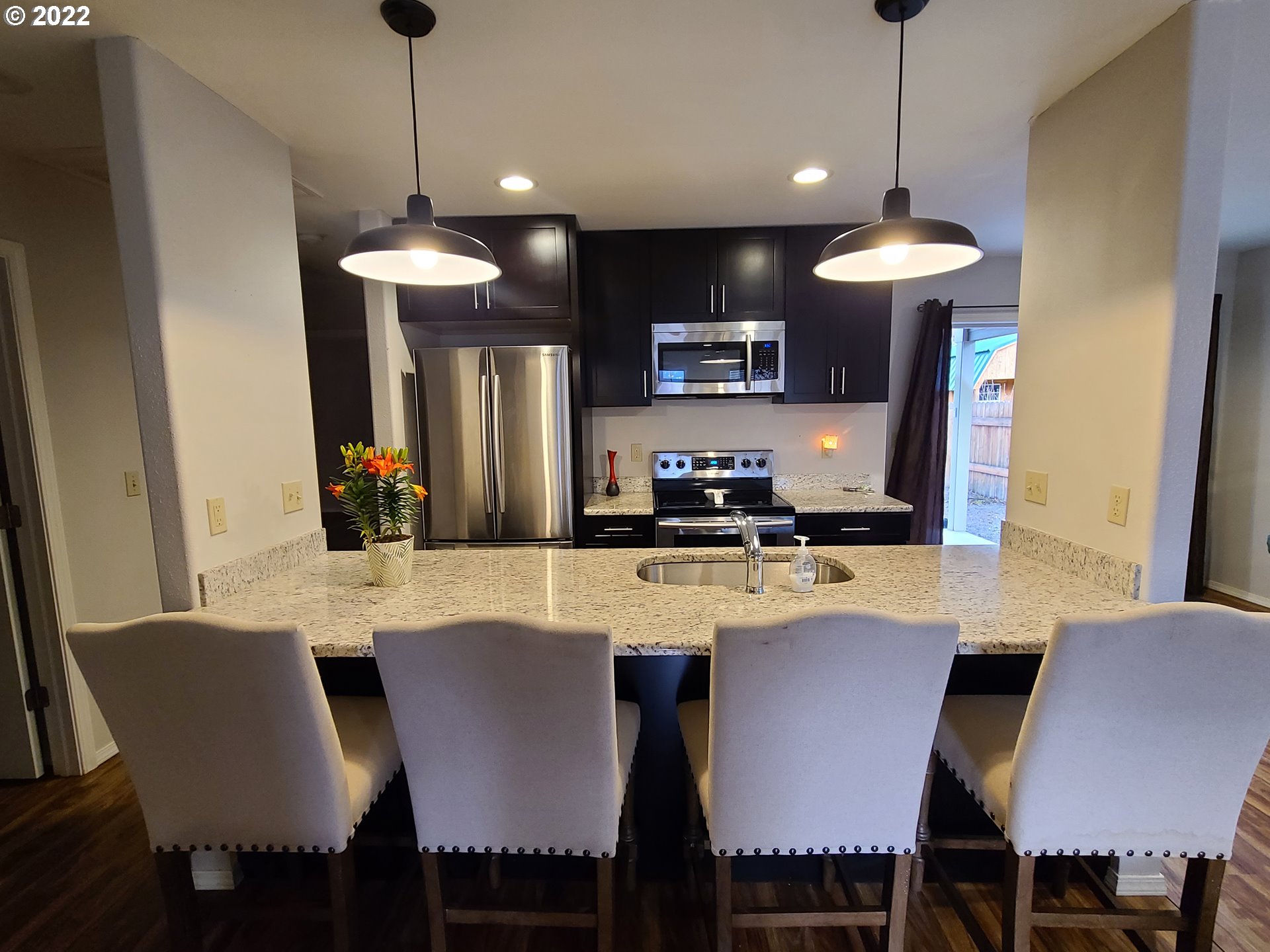 104 North College Street Joseph, OR 97846 - Photo 4 of 17 a view of a dining room with furniture window and wooden floor
