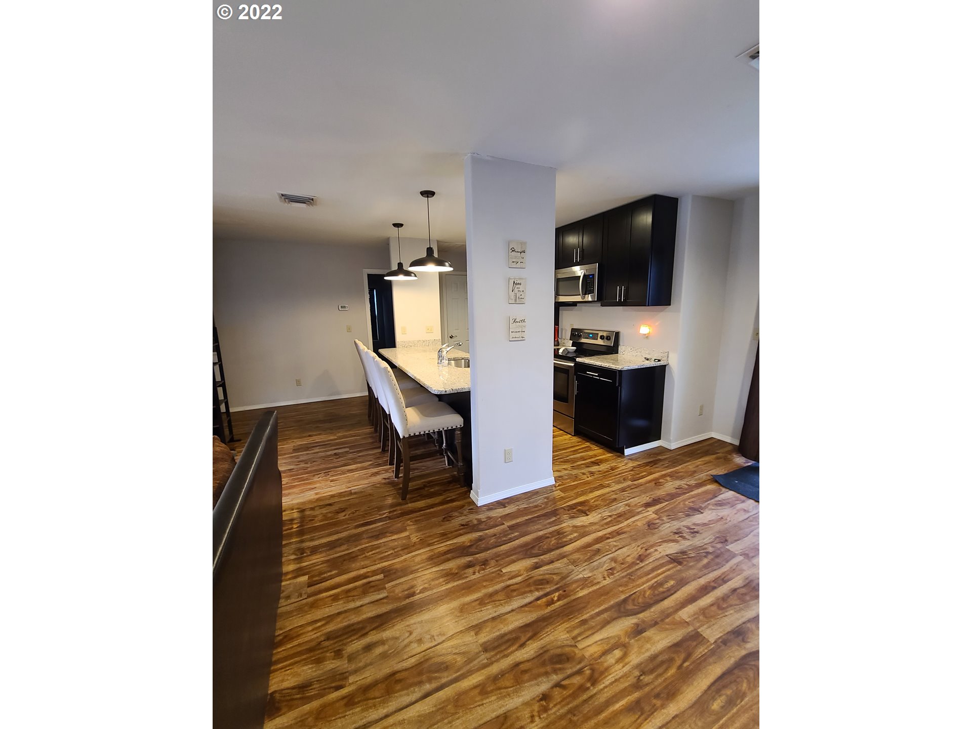 104 North College Street Joseph, OR 97846 - Photo 7 of 17 a living room with stainless steel appliances kitchen island furniture and a kitchen view