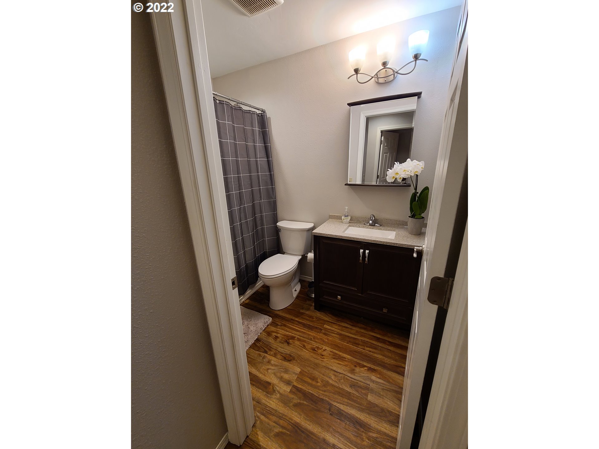 104 North College Street Joseph, OR 97846 - Photo 8 of 17 a bathroom with a sink a toilet and mirror