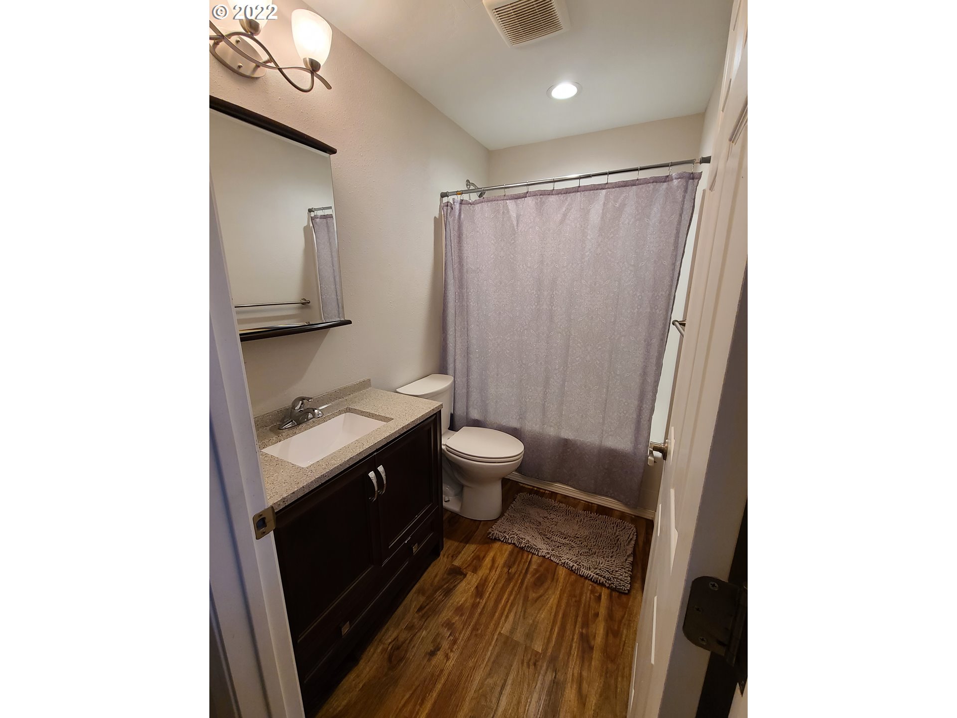 104 North College Street Joseph, OR 97846 - Photo 10 of 17 a bathroom with a sink a toilet a mirror and shower