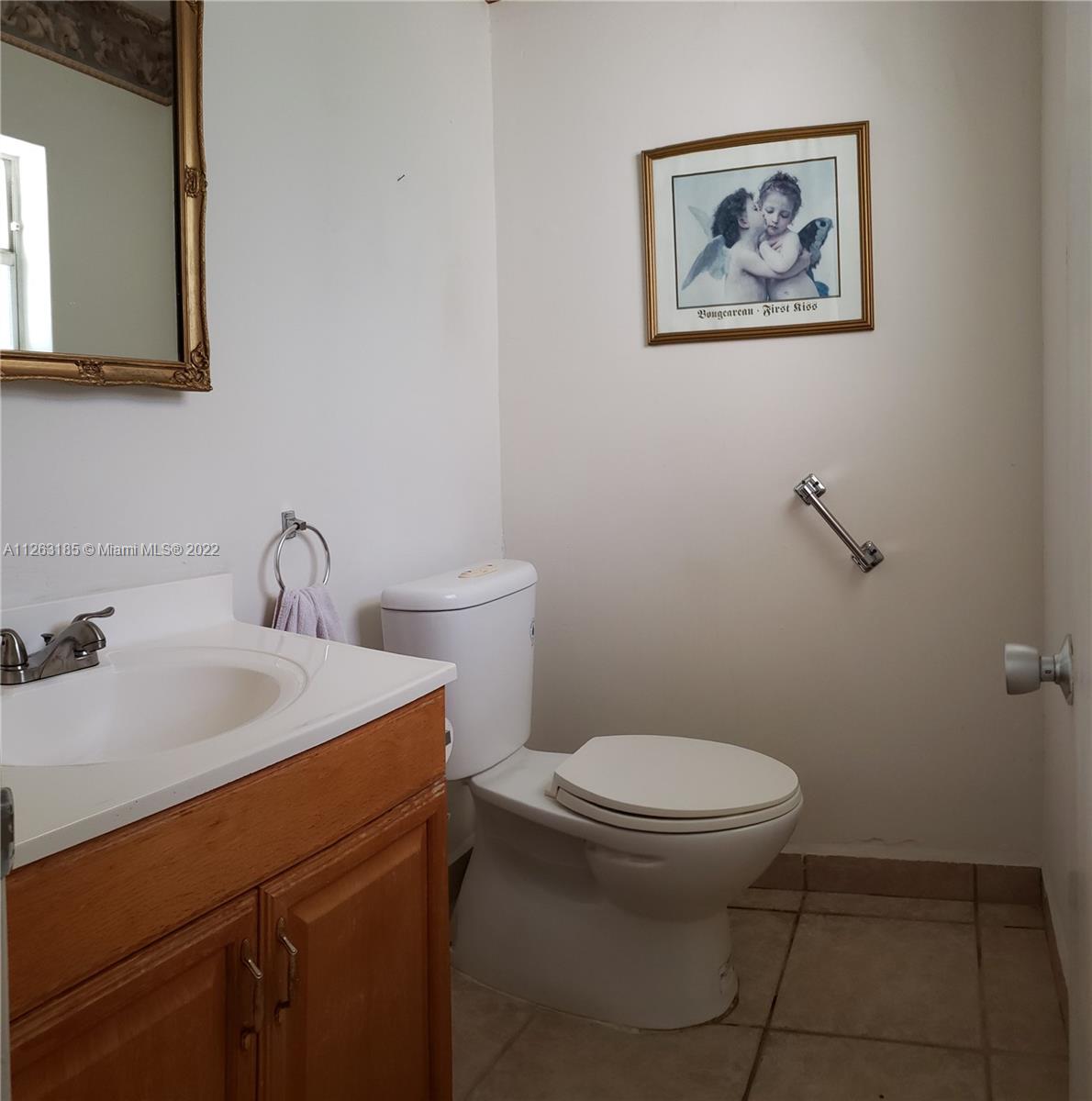 West Perrine Miami, FL 33157 - Photo 15 of 34 a bathroom with a toilet sink and mirror