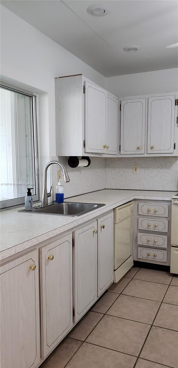 West Perrine Miami, FL 33157 - Photo 16 of 34 a kitchen with appliances a sink and cabinets