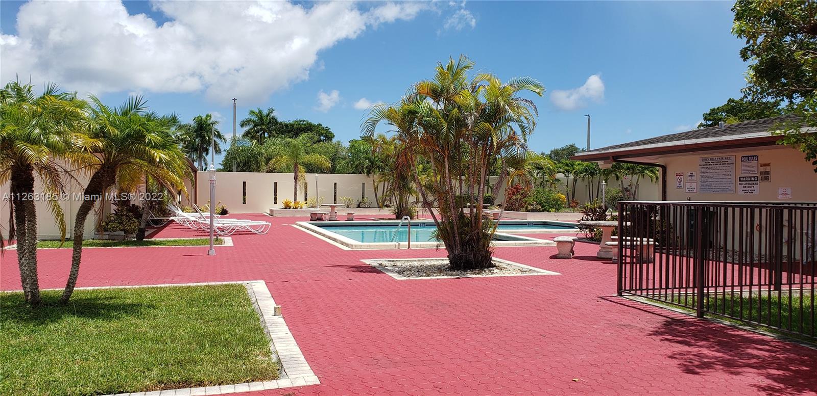 West Perrine Miami, FL 33157 - Photo 31 of 34 a swimming pool with outdoor seating and yard