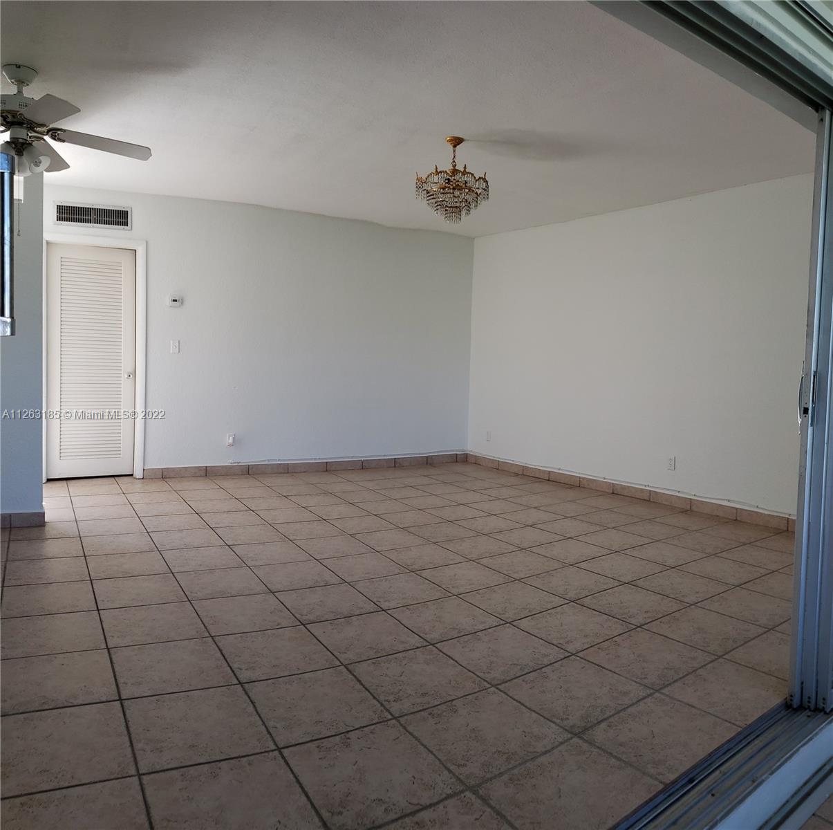 West Perrine Miami, FL 33157 - Photo 5 of 34 a view of an empty room and chandelier fan