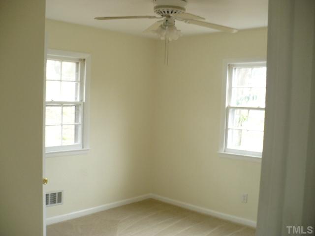 1324 Marlborough Road Raleigh, NC 27610 - Photo 9 of 10 an empty room with windows