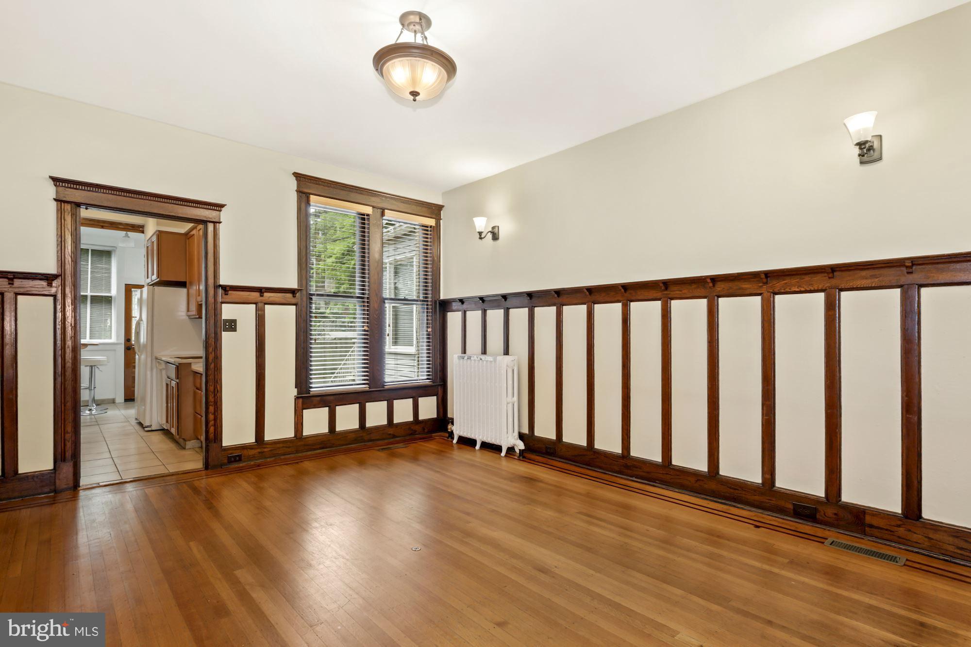 2610 Cathedral Avenue Northwest, Unit 1 Washington, DC 20008 - Photo 4 of 23 Living room with original trim