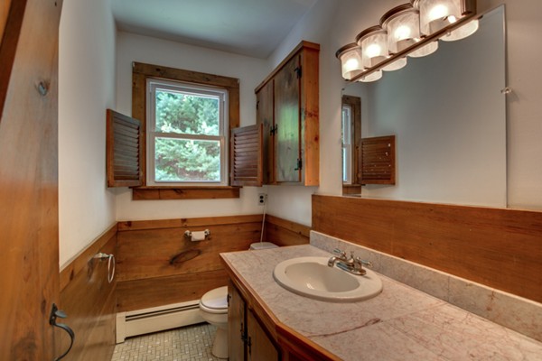 211 Littleton County Road Harvard, MA 01451 - Photo 19 of 30 a bathroom with a granite countertop sink and a mirror