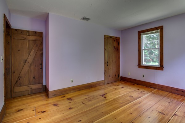 211 Littleton County Road Harvard, MA 01451 - Photo 22 of 30 an empty room with wooden floor and closet