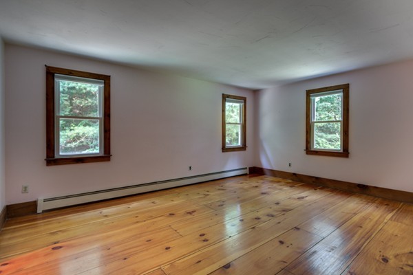 211 Littleton County Road Harvard, MA 01451 - Photo 23 of 30 an empty room with wooden floor and windows