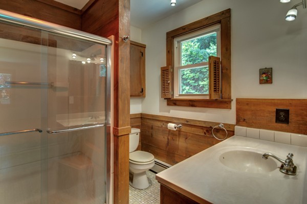 211 Littleton County Road Harvard, MA 01451 - Photo 25 of 30 a bathroom with a sink and a bathtub