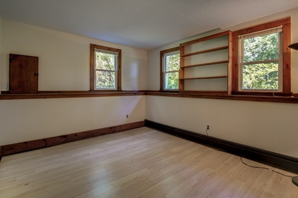 211 Littleton County Road Harvard, MA 01451 - Photo 26 of 30 a view of an empty room with wooden floor and a window