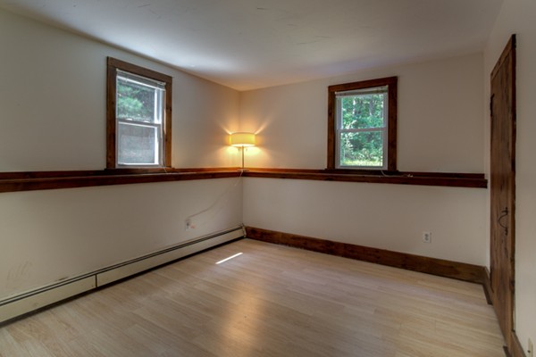 211 Littleton County Road Harvard, MA 01451 - Photo 27 of 30 an empty room with wooden floor and windows