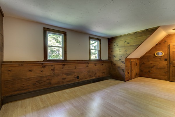 211 Littleton County Road Harvard, MA 01451 - Photo 29 of 30 a view of an empty room with window and wooden floor