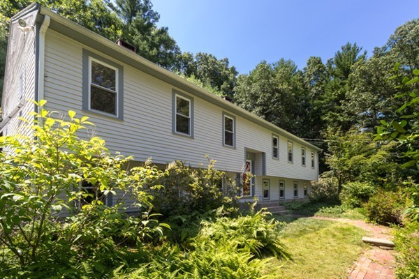 211 Littleton County Road Harvard, MA 01451 - Photo 3 of 30 a front view of a house with a yard
