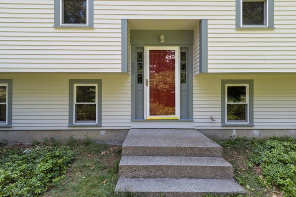211 Littleton County Road Harvard, MA 01451 - Photo 4 of 30 a front view of a house with garage