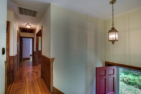211 Littleton County Road Harvard, MA 01451 - Photo 7 of 30 a view of a hallway with wooden floor and staircase