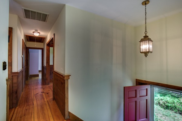 211 Littleton County Road Harvard, MA 01451 - Photo 8 of 30 a view of a hallway with wooden floor and staircase