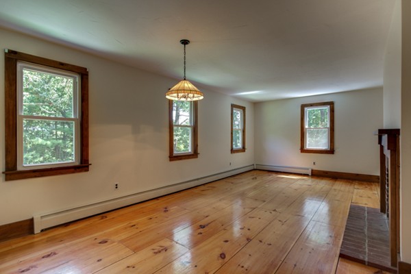 211 Littleton County Road Harvard, MA 01451 - Photo 9 of 30 a view of an empty room with window and wooden floor