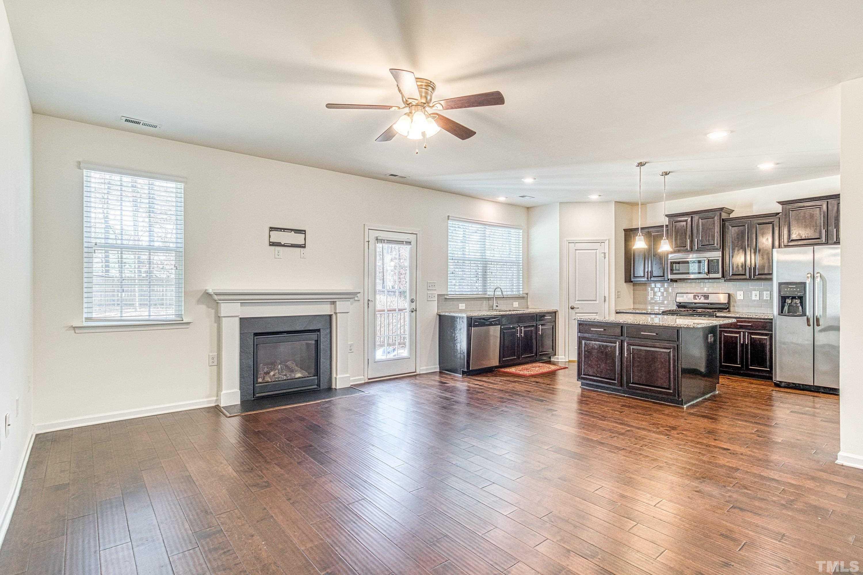 3617 Lily Orchard Way Cary, NC 27518 - Photo 15 of 47 a large kitchen with a stove top oven and refrigerator