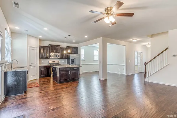 a view of kitchen with cabinets and wooden floor
