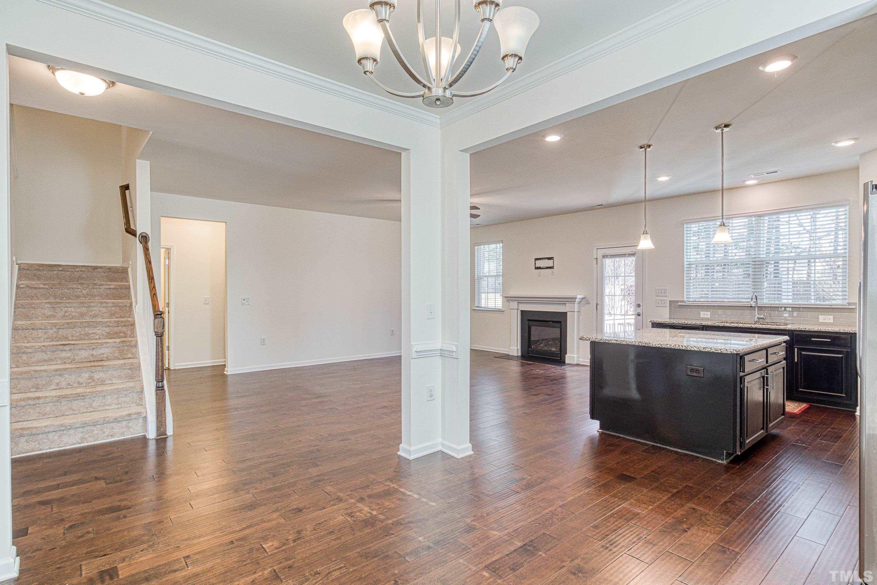 3617 Lily Orchard Way Cary, NC 27518 - Photo 25 of 47 a open kitchen with a refrigerator and a stove top oven