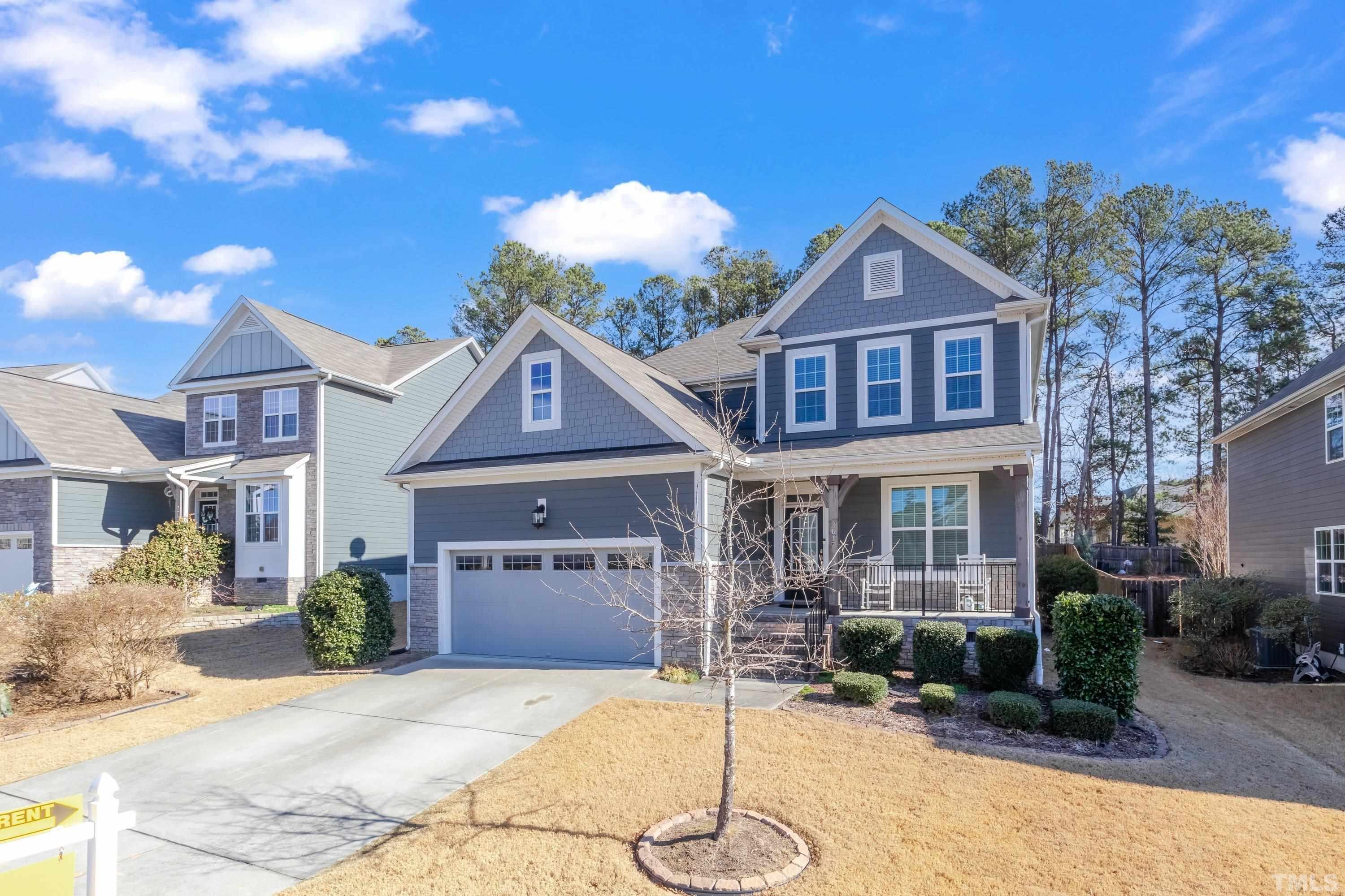 3617 Lily Orchard Way Cary, NC 27518 - Photo 3 of 47 a front view of a house with a yard