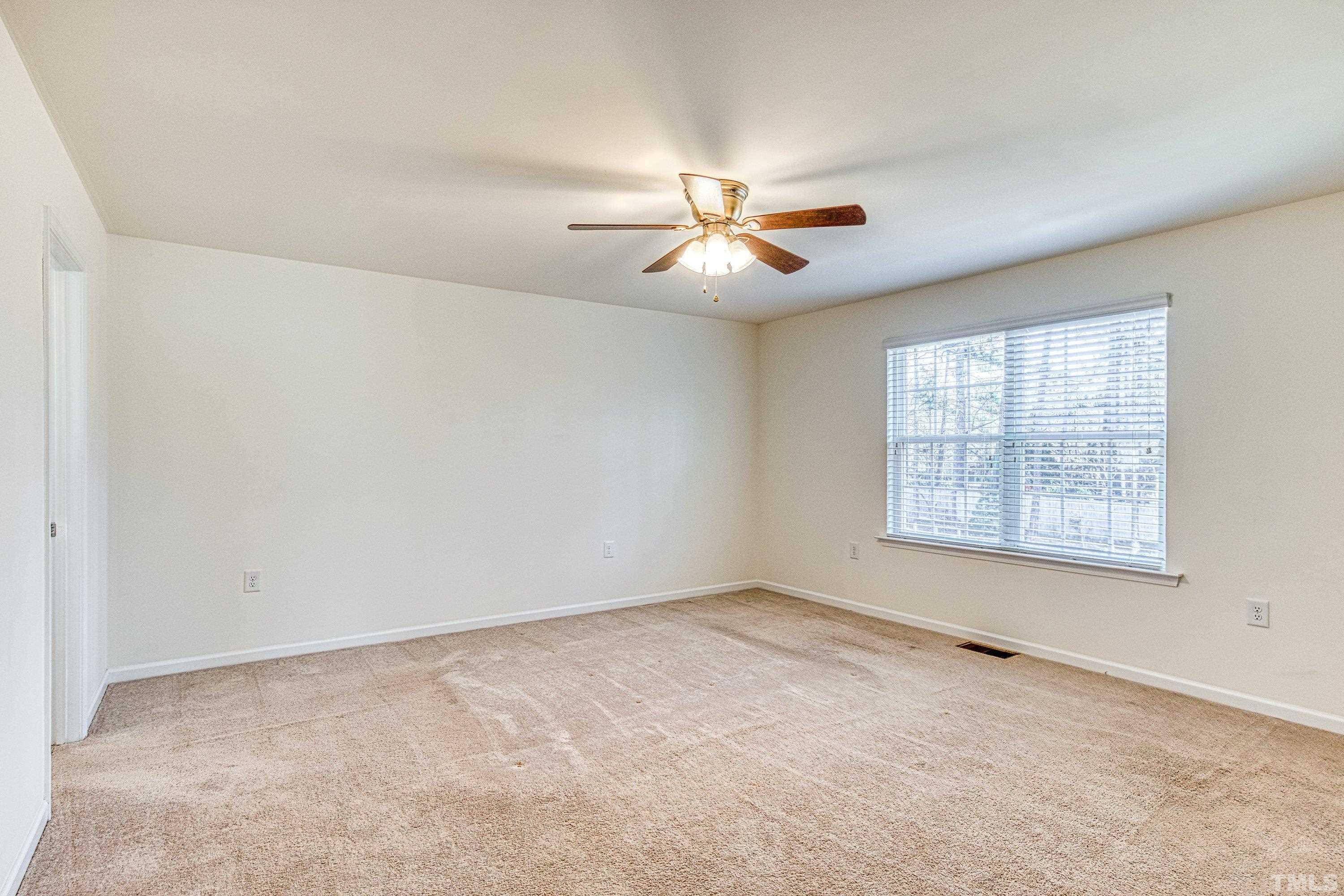3617 Lily Orchard Way Cary, NC 27518 - Photo 32 of 47 a view of an empty room with a window