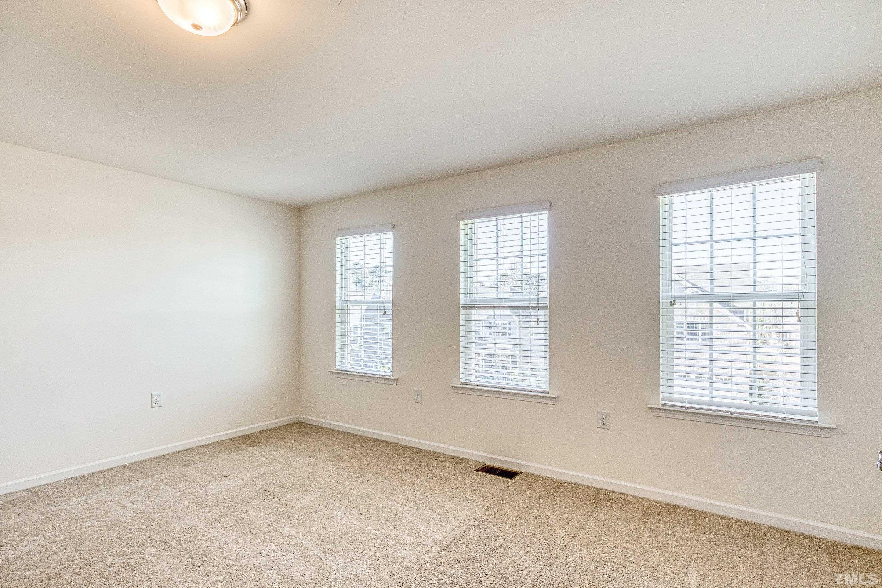 3617 Lily Orchard Way Cary, NC 27518 - Photo 37 of 47 an empty room with windows