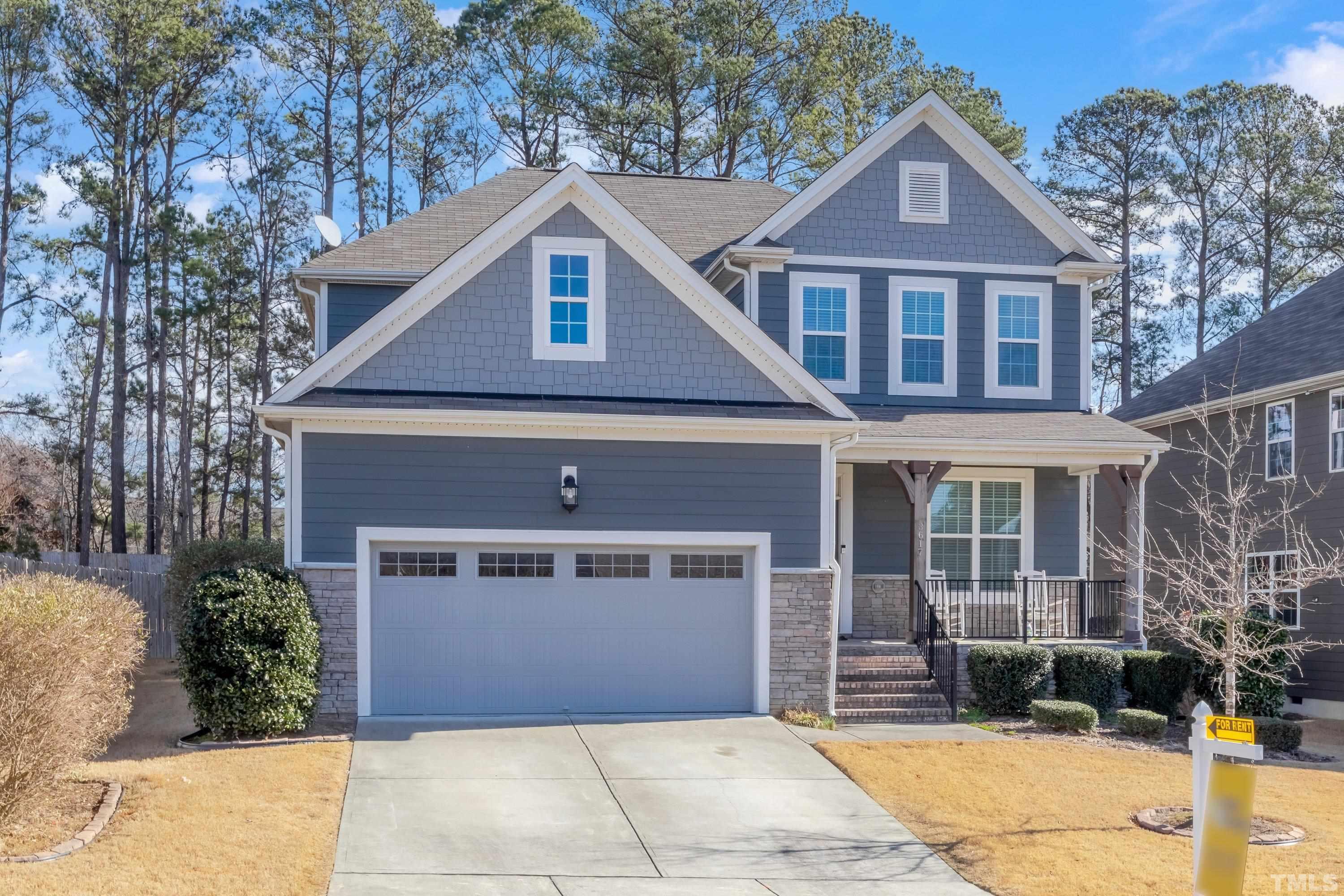 3617 Lily Orchard Way Cary, NC 27518 - Photo 4 of 47 a front view of a house with a garden