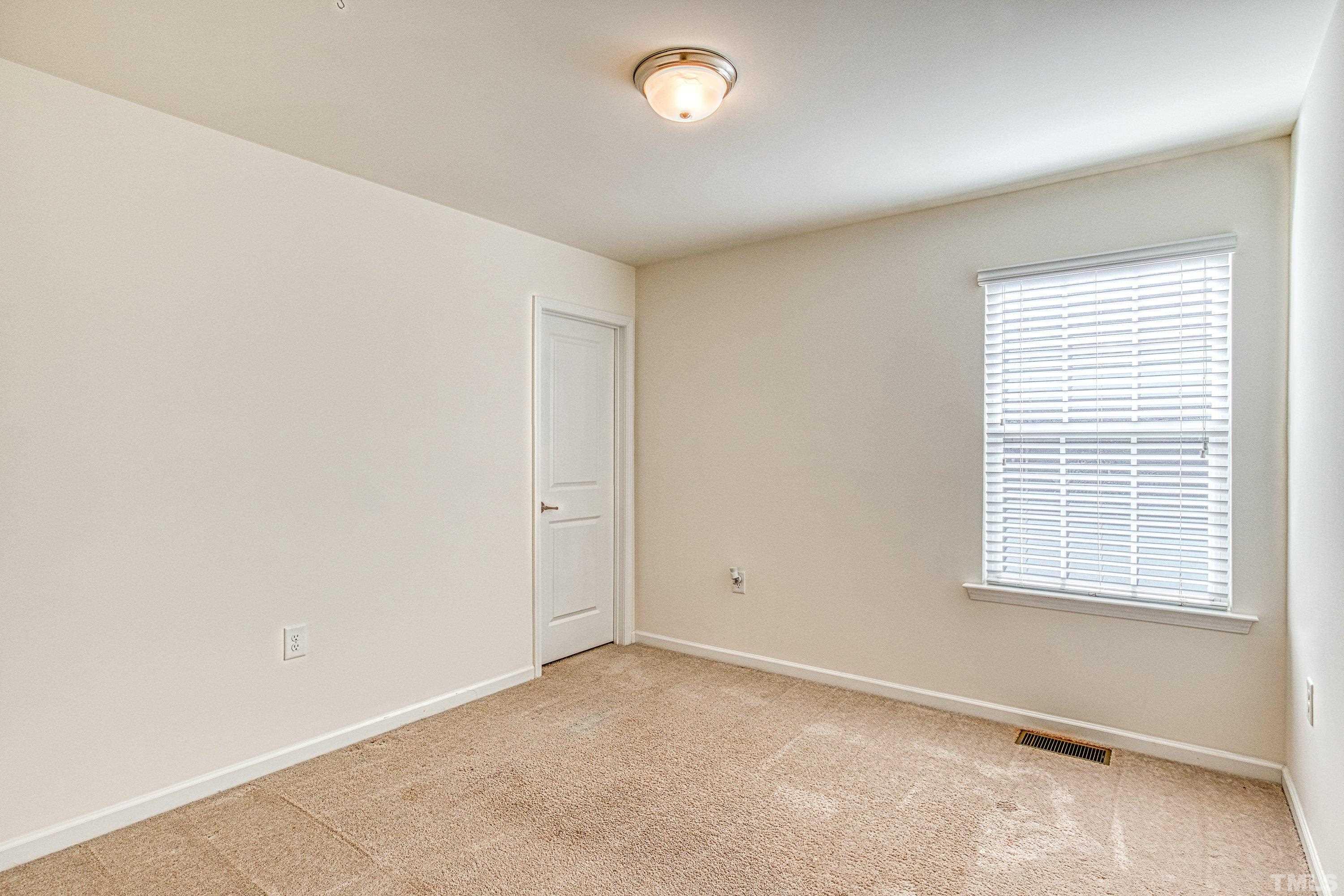 3617 Lily Orchard Way Cary, NC 27518 - Photo 41 of 47 a view of an empty room with a window