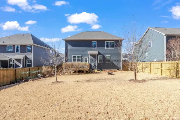 a wooden bench sitting in front of a building