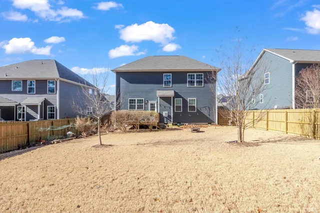 a wooden bench sitting in front of a building