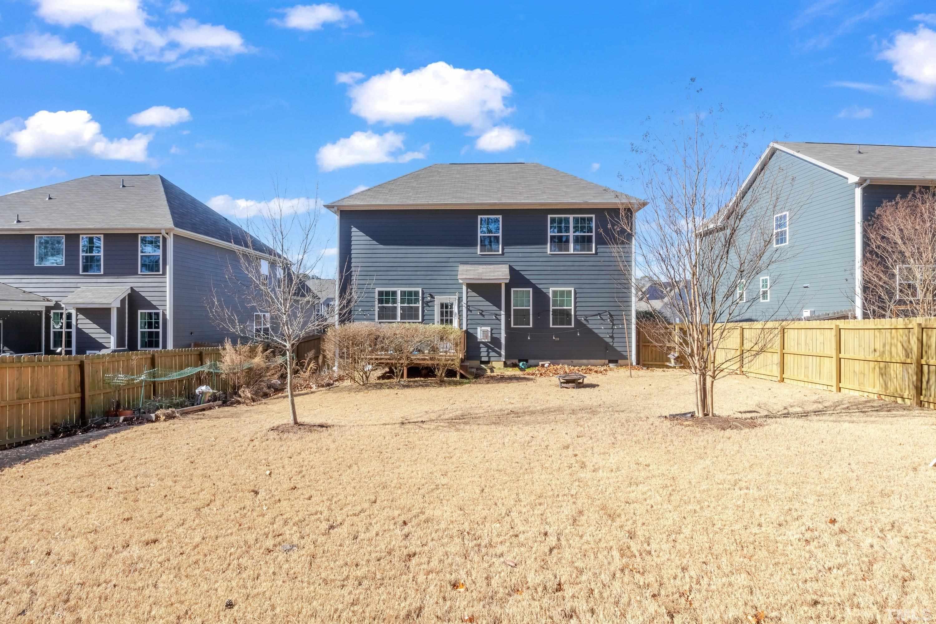 3617 Lily Orchard Way Cary, NC 27518 - Photo 44 of 47 a wooden bench sitting in front of a building