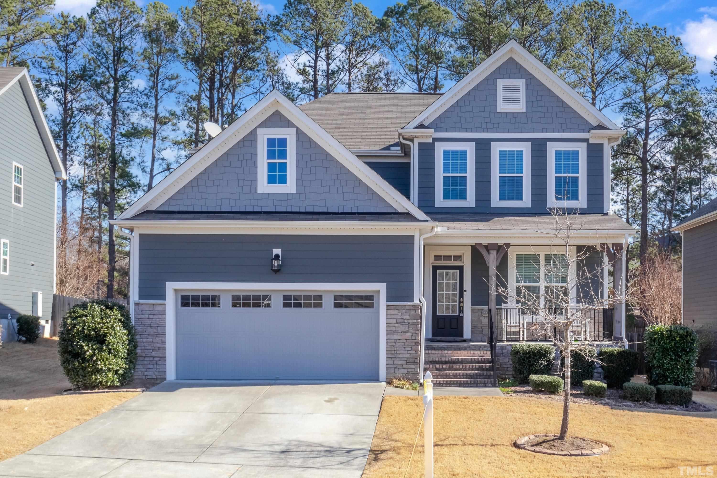 3617 Lily Orchard Way Cary, NC 27518 - Photo 5 of 47 a front view of a house with garden